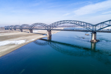 Gerola bridge in winter. Ancient iron bridge, built in 1913, on the river Po in the province of...