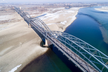 Gerola bridge in winter. Ancient iron bridge, built in 1913, on the river Po in the province of...
