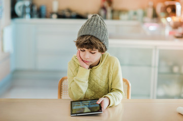 Little boy using digital tablet.