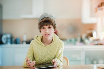 Little boy using digital tablet.