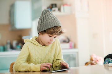 Little boy using digital tablet.
