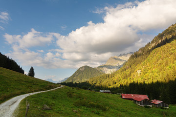 Tourists in the Alpine mountains in the French valleys with beautiful landscapes.
