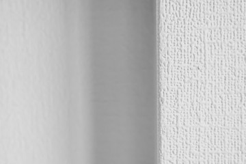  Roughness texture White wallpaper on the wall at a different angle. An example of old wallpaper.