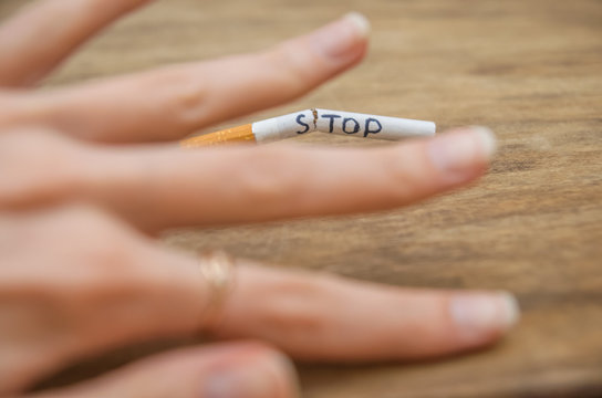 Quitting smoking concept. Hand is refusing cigarette offer. Stop smoking and healtcare concept