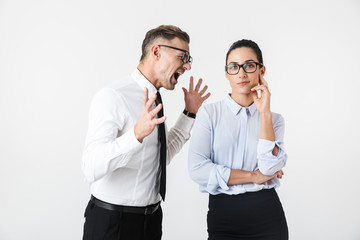 Displeased angry quarrel business colleagues couple isolated over white wall background.