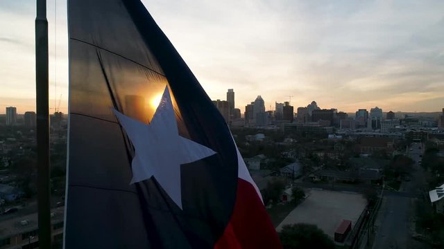 4K Texas Flag Slowly Blows in Breeze at Sunset in Austin