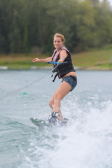 girl wakeboarding on the lake