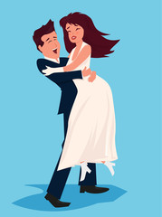 Groom holding bride in his arms