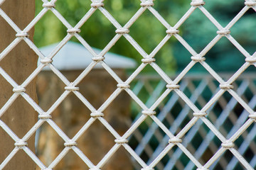 Fototapeta premium Iron mesh fence for forbidden passage of people.