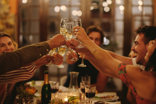 Friends Having Drinks To Celebrate A Special Occasion