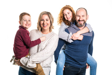 A Beautiful happy family together on studio white background