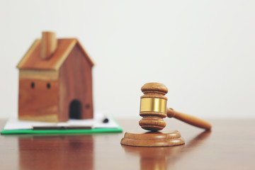 Property auction, Gavel wooden and model house on white background, lawyer of home real estate and ownership property concept