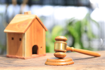 Property auction, Gavel wooden and model house on natural green background, lawyer of home real estate concept