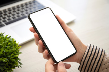 female hands holding phone with isolated screen in the office