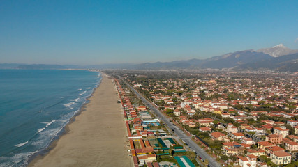 Fototapeta premium Aerial panoramic view of Forte dei Marmi skyline on a sunny winter morning, drone perspective