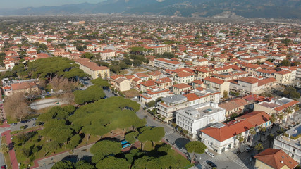 Fototapeta na wymiar Aerial panoramic view of Forte dei Marmi skyline on a sunny winter morning, drone perspective