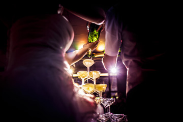 Ceremonial of the champagne fountain during a colorful and magical wedding