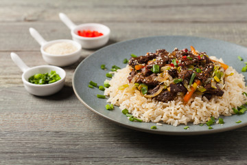 Traditional Korean Bulgogi dish.  Thinly cut, grilled beef, served with rice and vegetables.