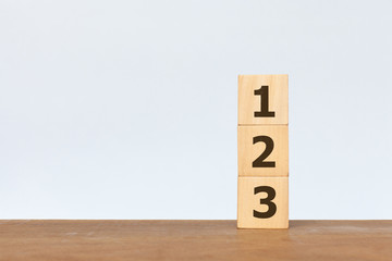 Wooden cube with the number 1 2 3 on white background. Concept of success, winner, victory or top ranking