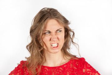 Young women is very angry and grinning. Concept emotion anger