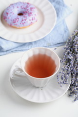 Obraz na płótnie Canvas Lavender tea and lavender donut