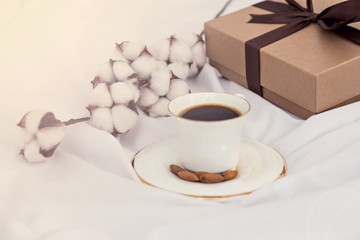 Bouquet of flowers - tulips, gift and coffee.