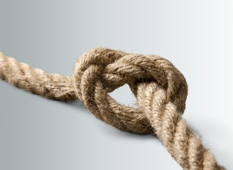 Tug war, two businessman pulling a rope in opposite directions