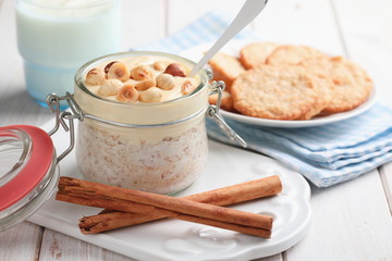 Overnight oats with cinnamon, nuts, yogurt, and oatmeal cookies