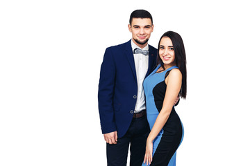 young happy stylish couple in blue clothes posing on white background