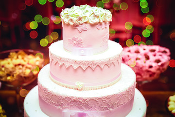 Wedding cake decoration with colorful flowers is served at wedding receptions. Vintage style for weddings, birthdays.