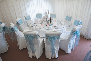 Wedding table reception area decorated for evening dinner