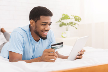 Man purchasing product online, using credit card to pay