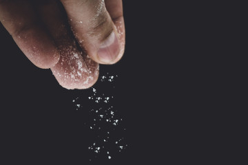 seasoning salt cooking on black background