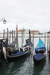 Fototapeta na wymiar Gondolas in Venice Italy Adriatic sea. Markusdom. St Mark's Basilica Square. Saint Marco Square. 