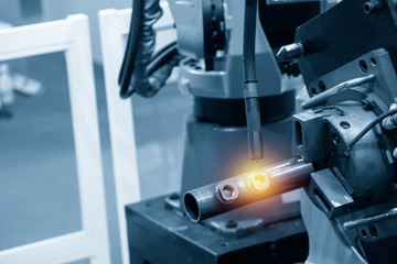The operation of welding robot machine .Industrial 4.0 concept for modern manufacturing process.