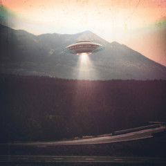 Unidentified flying object UFO. Old style photo with high ISO noise and dirt with scratches over...