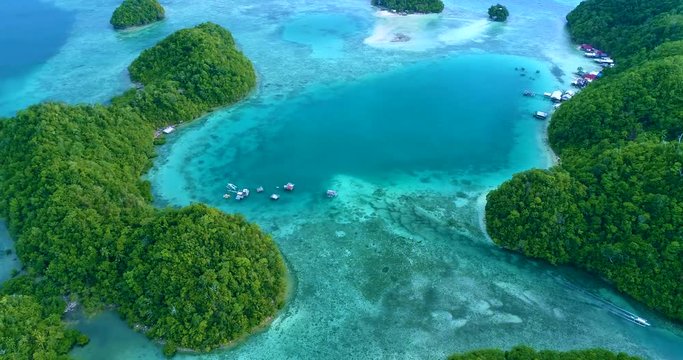 Aerial view flying over the beautiful and tropical green mountains Sugba Lagoon in Siargao, Philippines