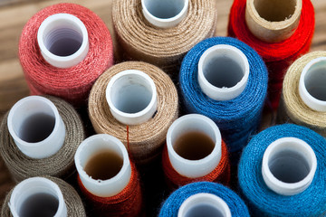 several varicolored spools of thread