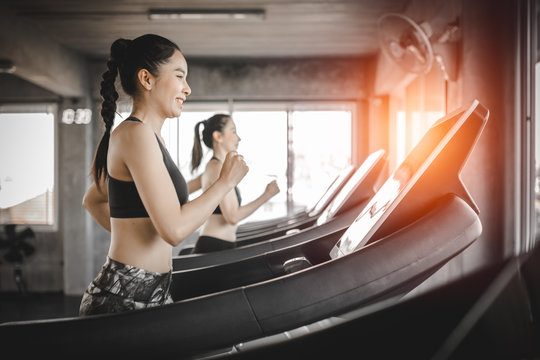 Side view of attractive sports women on running track. Healthy, sports, lifestyle, Fitness concept.