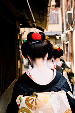Maiko (apprentice geishas) observe Hassaku, in Gion area of Kyoto