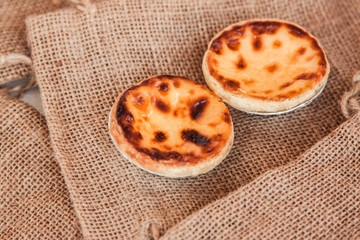 Egg tart dessert yummy , traditional Portuguese dessert on sack bag. food from custard and eggs delicious - Image 