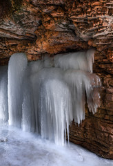 Frozen waterfall in a mountain gorge