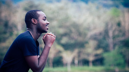 African man praying for thank god,16:9 style