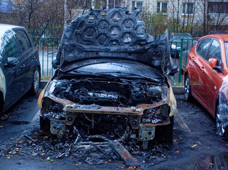 burnt cars in the yard in the morning