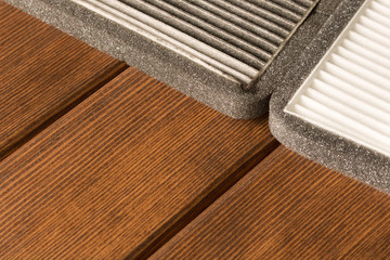 New and old car air filter. Close up.