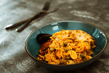 Paella with chicken, seafood and chorizo
