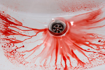 Flowing blood in the sink. Murder concept background