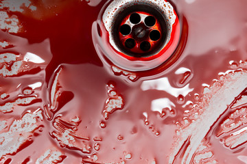 Flowing blood in the sink. Murder concept background