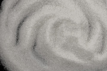 Scattered sugar on a black background