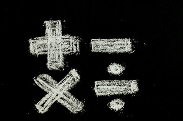 math symbols written on chalkboard